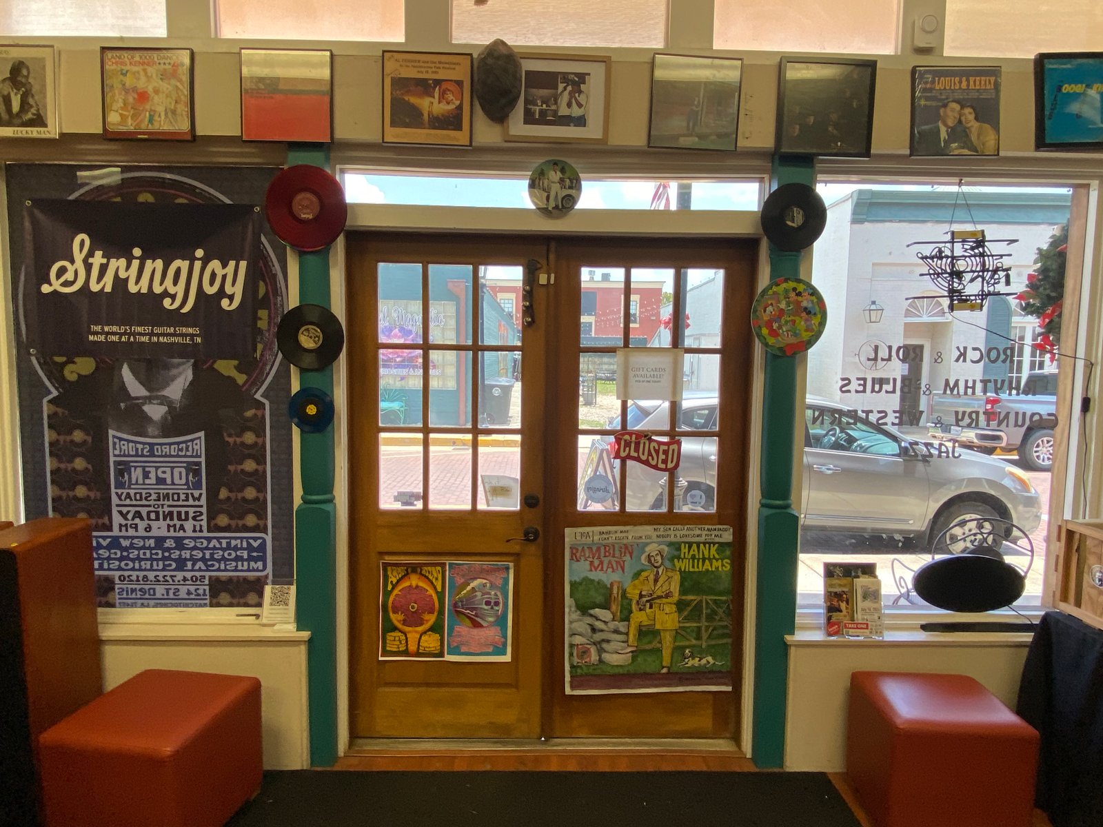 Inside Laughing Sam's — Grateful Dead flag, Pink Floyd, guitars, and walls of music history